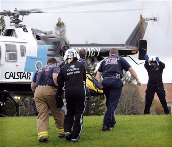 Vacaville and CALSTAR paramedics carry a bomb victim to an air ambulance at Ridgeview Park on March 27. According to police, at about 10:30 a.m., an elderly man on Cashel Circle was severely injured when a possible pipe bomb wrapped inside of a newspaper exploded in his driveway. Numerous bomb squads responded to the scene as police evacuated residents from homes and blocked off a wide radius after an additional suspicious package was located in the area.